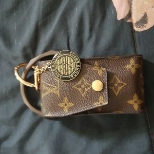 Louis Vuitton mini pouch wristlet with charms or lanyard